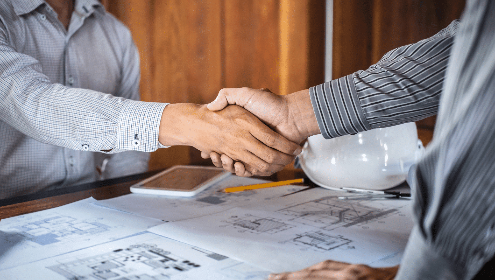 Construction professionals shaking hands